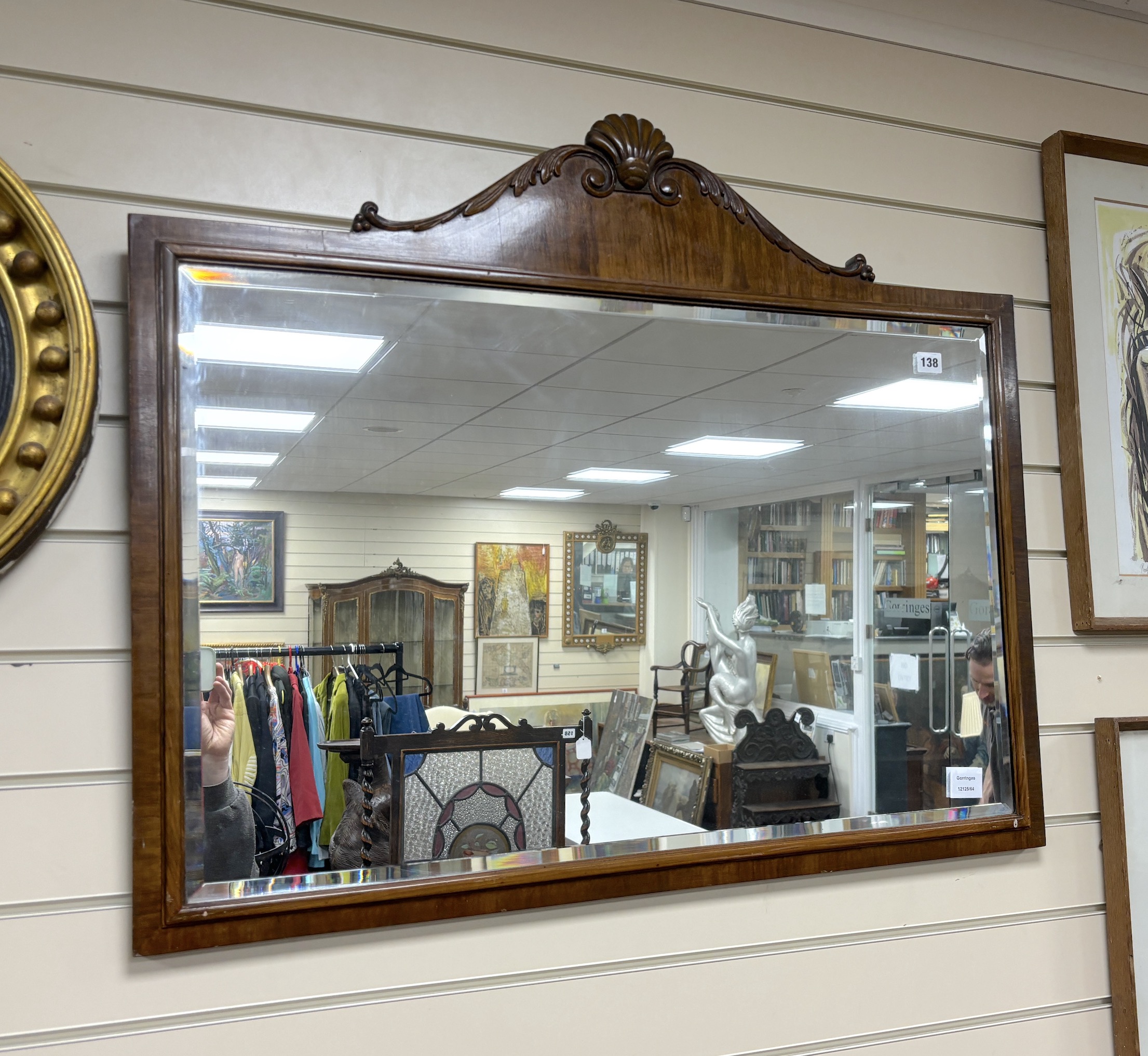 A Queen Anne revival walnut scallop crested wall mirror, width 91cm, height 77cm